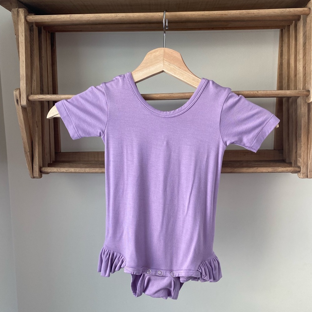 Kate Quinn, new with tags, short sleeve, ruffle leg, bodysuit. Size 12-18m